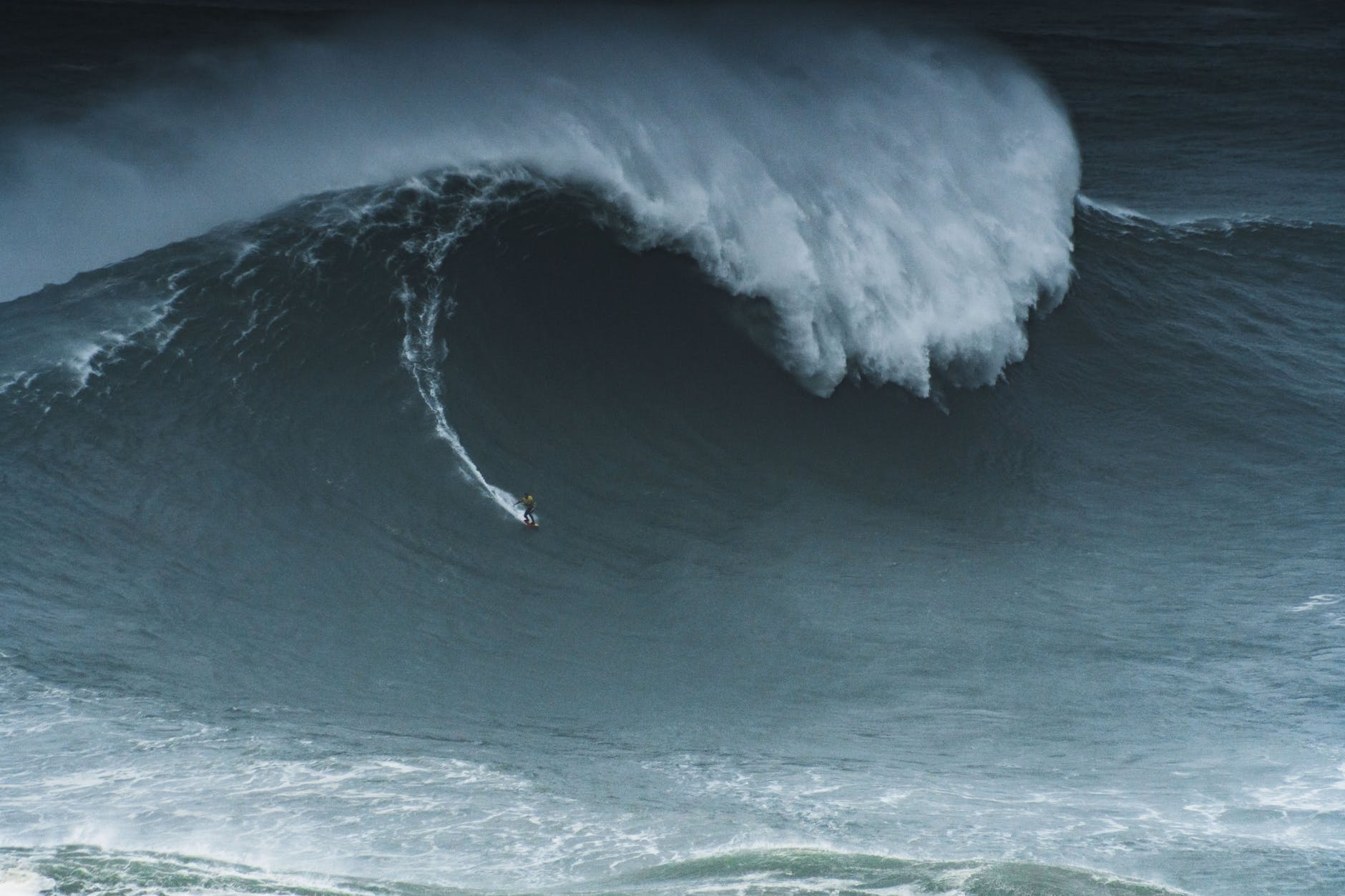person surfing on sea waves